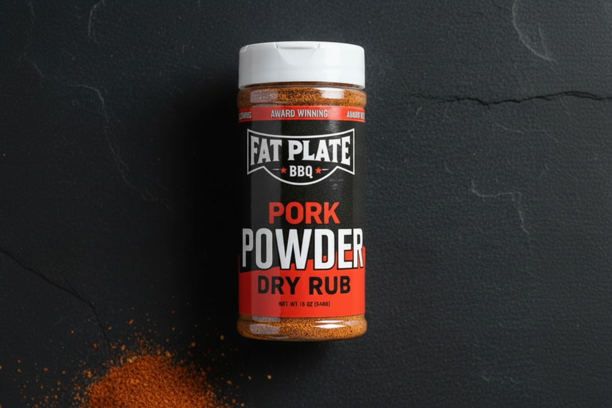 Jar of Fat Plate BBQ Pork Powder Dry Rub on a dark surface