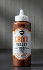 Bottle of Croix Valley Spicy Bourbon BBQ Sauce on a white background