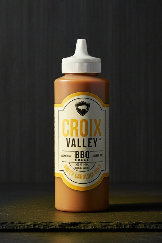 Bottle of Croix Valley BBQ Sauce with a white cap on a black background