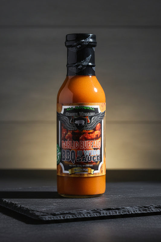 Bottle of Garlic Buffalo BBQ Sauce with a black label on a white background