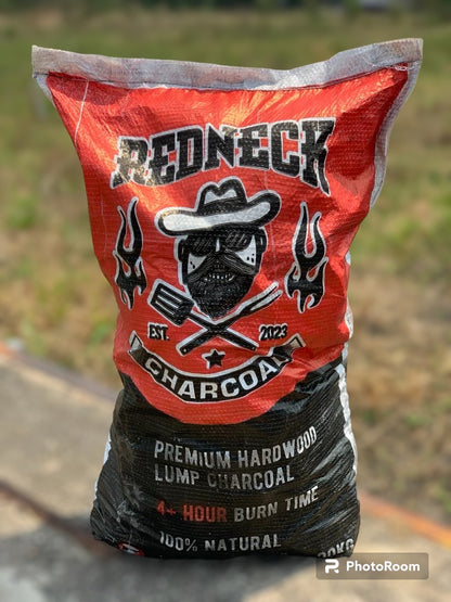 Bag of Redneck Charcoal with branding and product details on a blurred outdoor background
