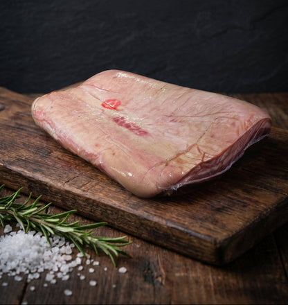 Raw meat on a wooden cutting board with text about 'Pure Flavor. Prime Cut.'